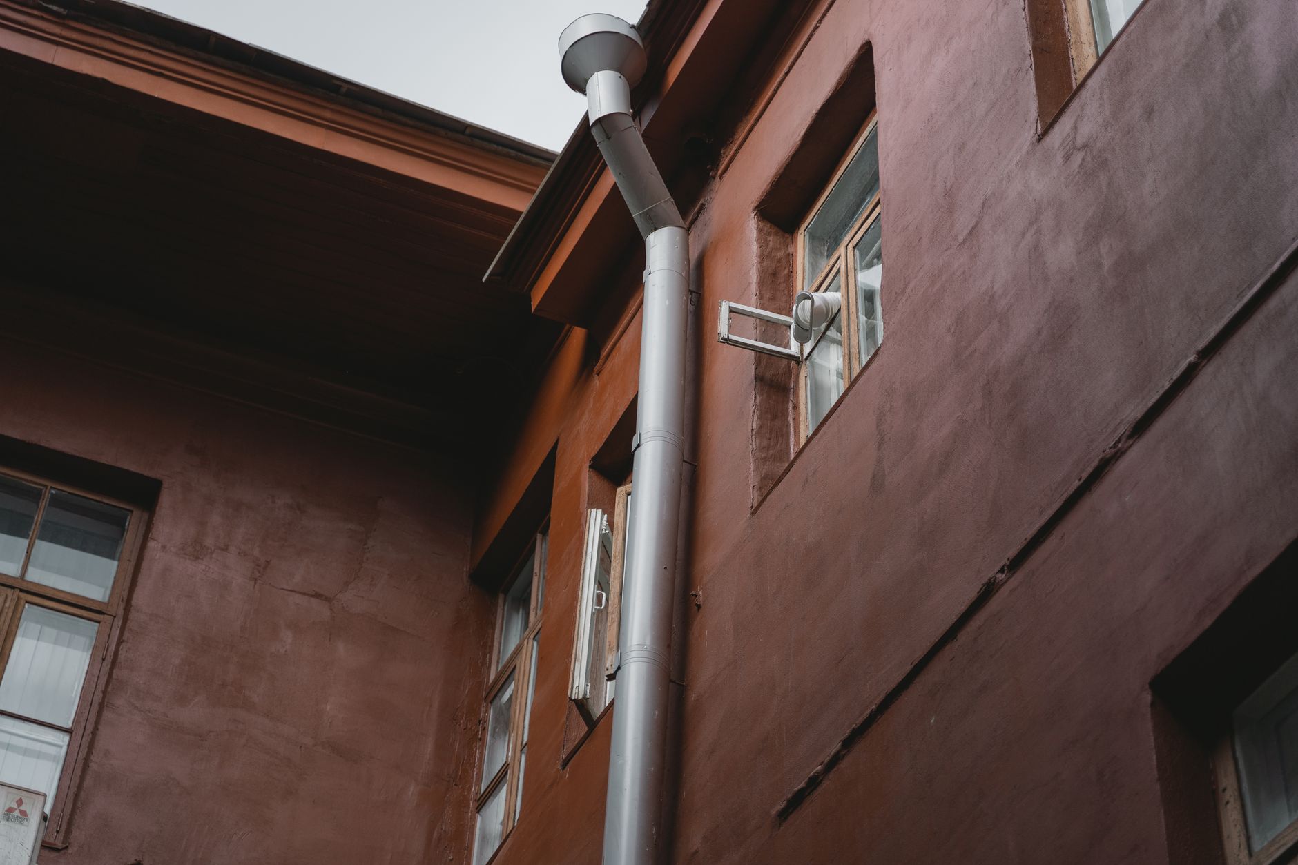 After image showing restored property with new flashing and sealed roof-wall junction, dry interior surfaces